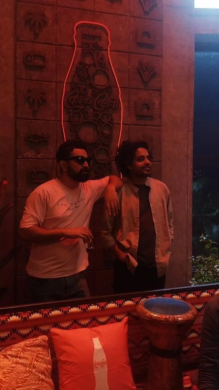 Giash Shaheen candid at a Coca-Cola themed venue