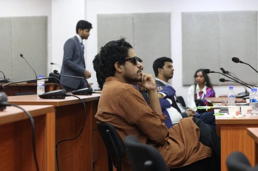 Giash Shaheen listening at a panel